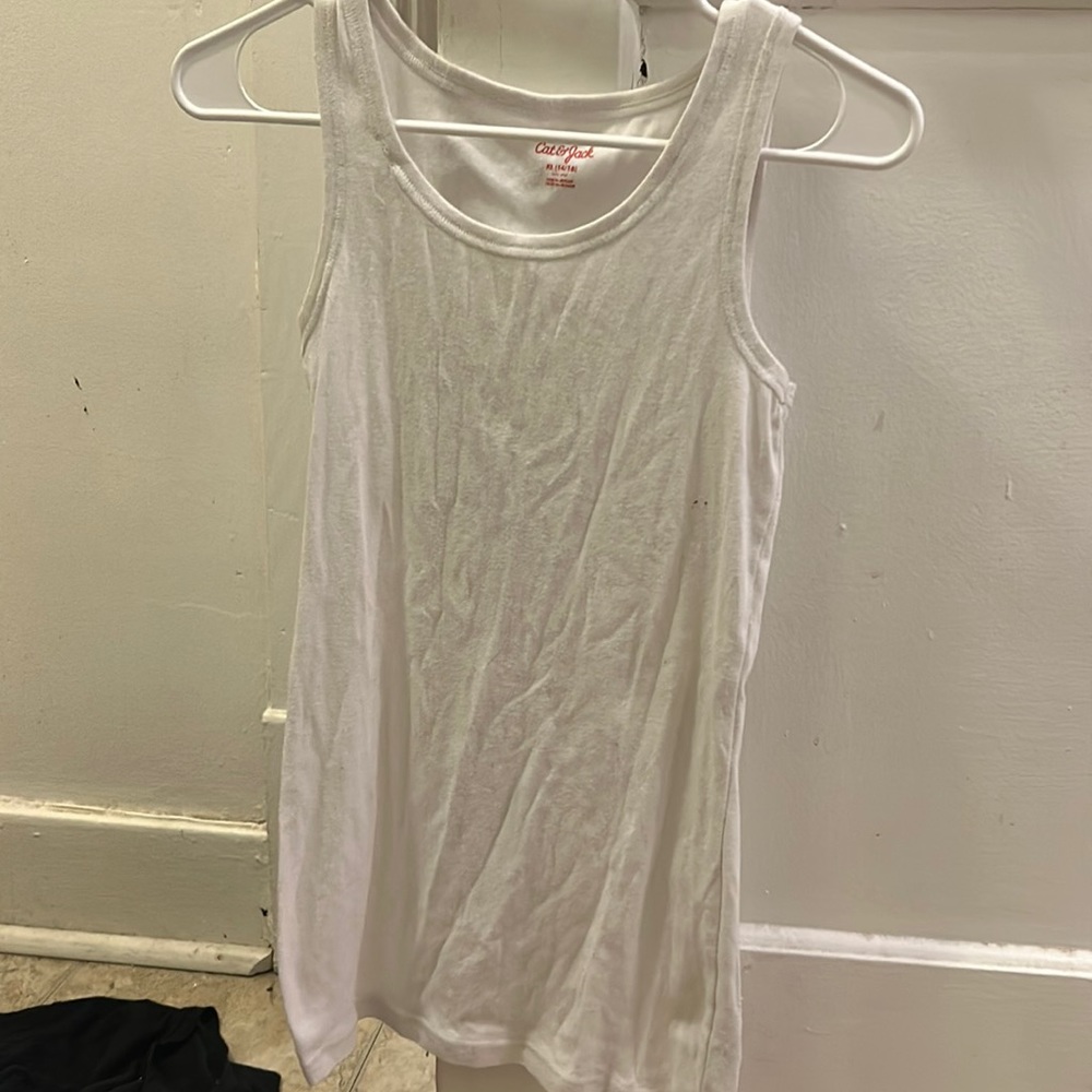A tang top got under sweaters or even under anything else.
